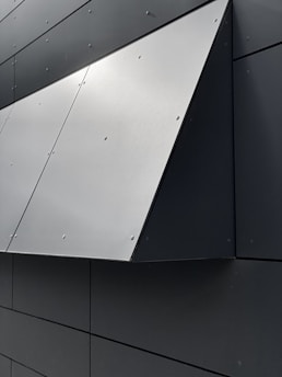 Close-up of a sleek aluminium exterior panel installation on a modern building