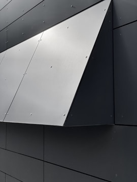 Modern building facade with sleek ACM panels and clean lines.