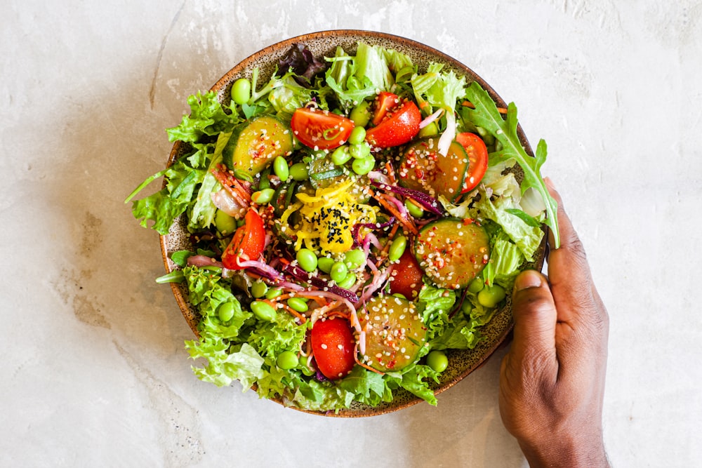 vegetable salad on brown ceramic plate