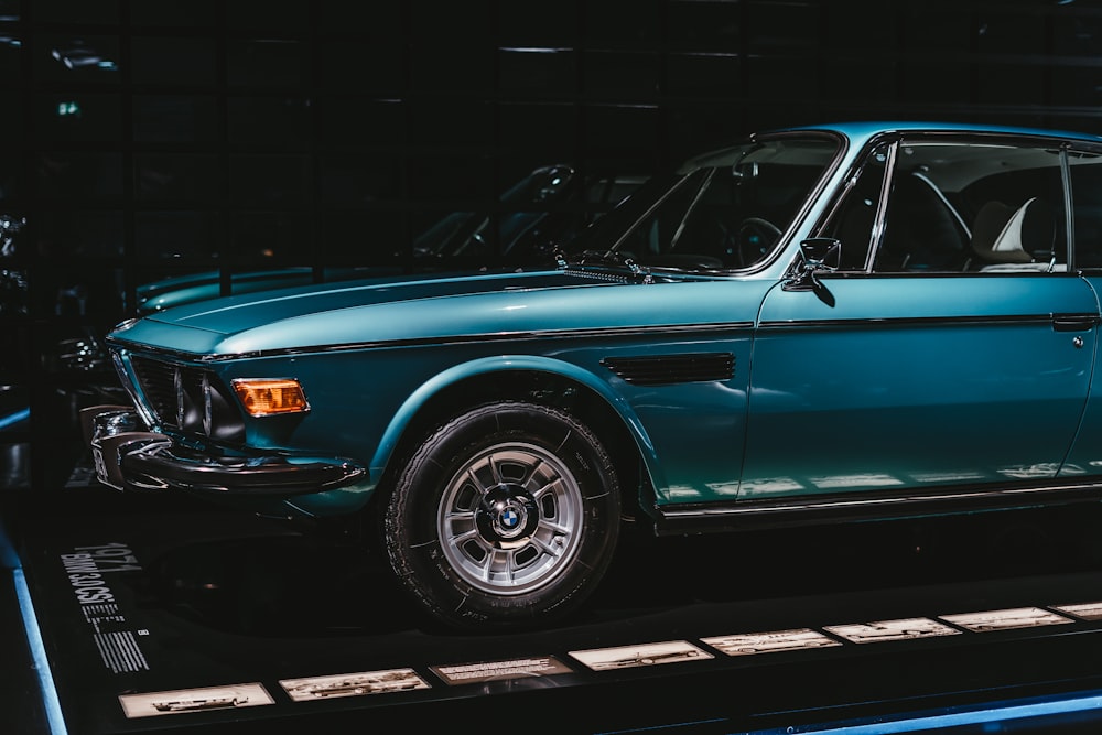 blue car parked in garage