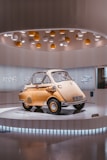 A stylish microcar showcasing its features.