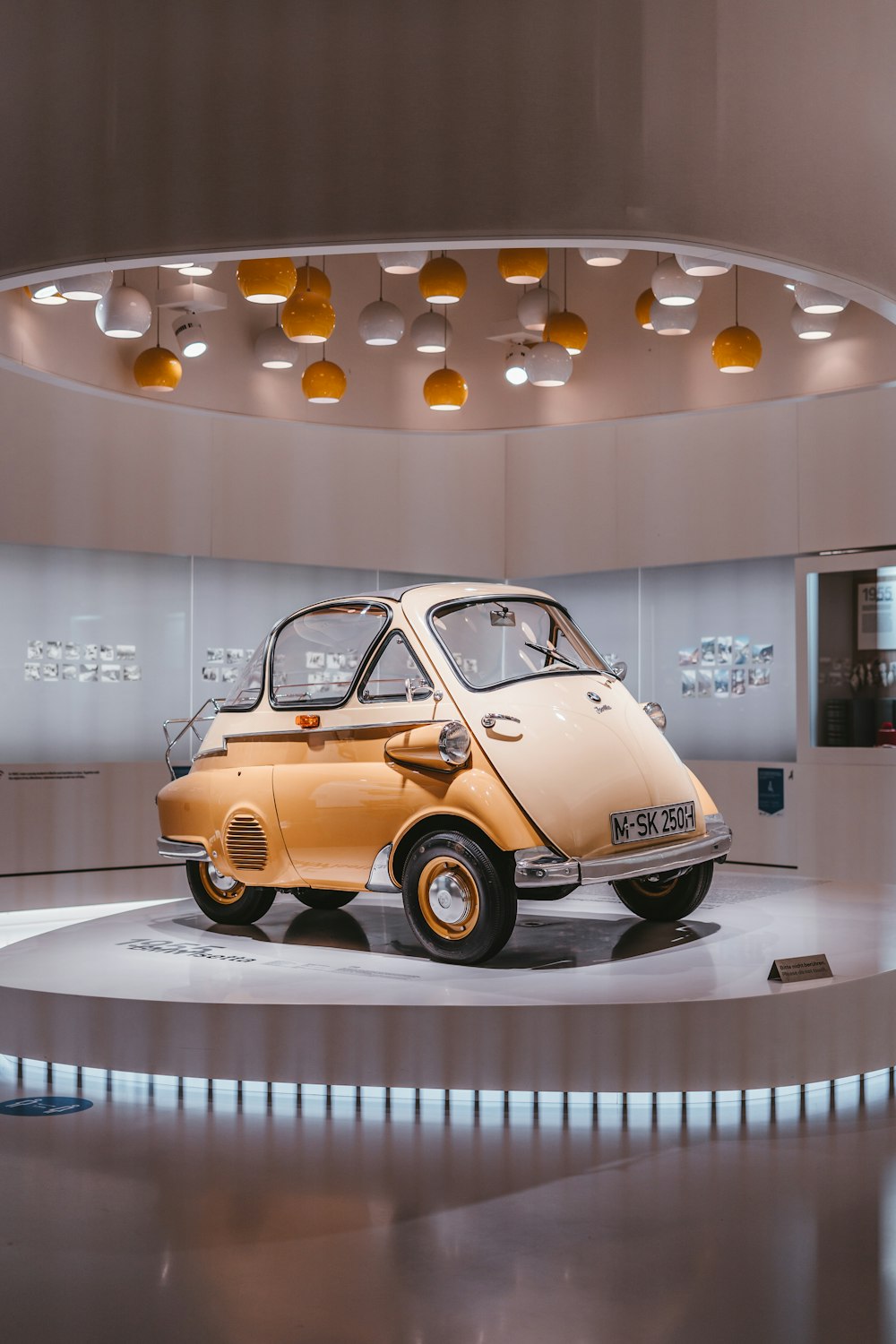 brown volkswagen beetle parked on white concrete building