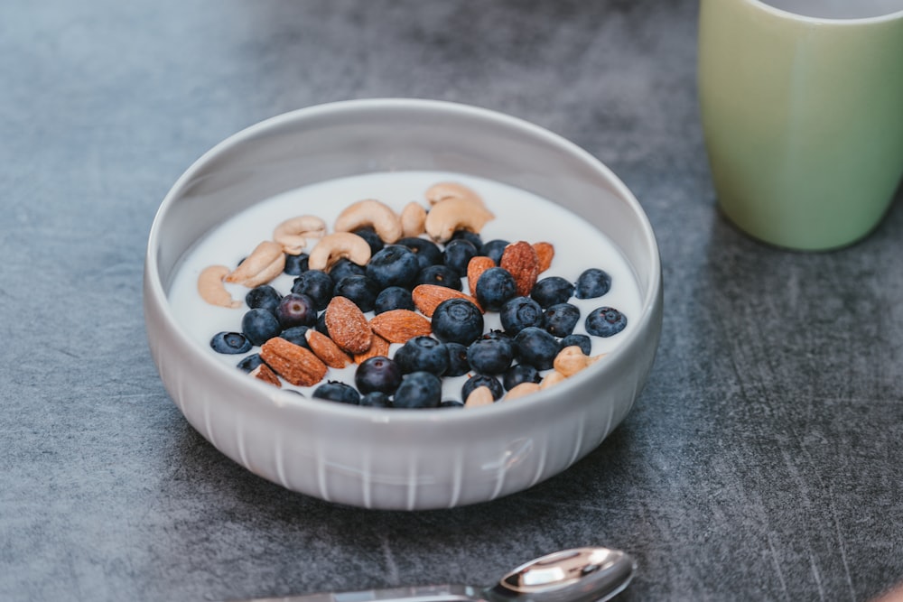 white ceramic bowl with brown and black beans