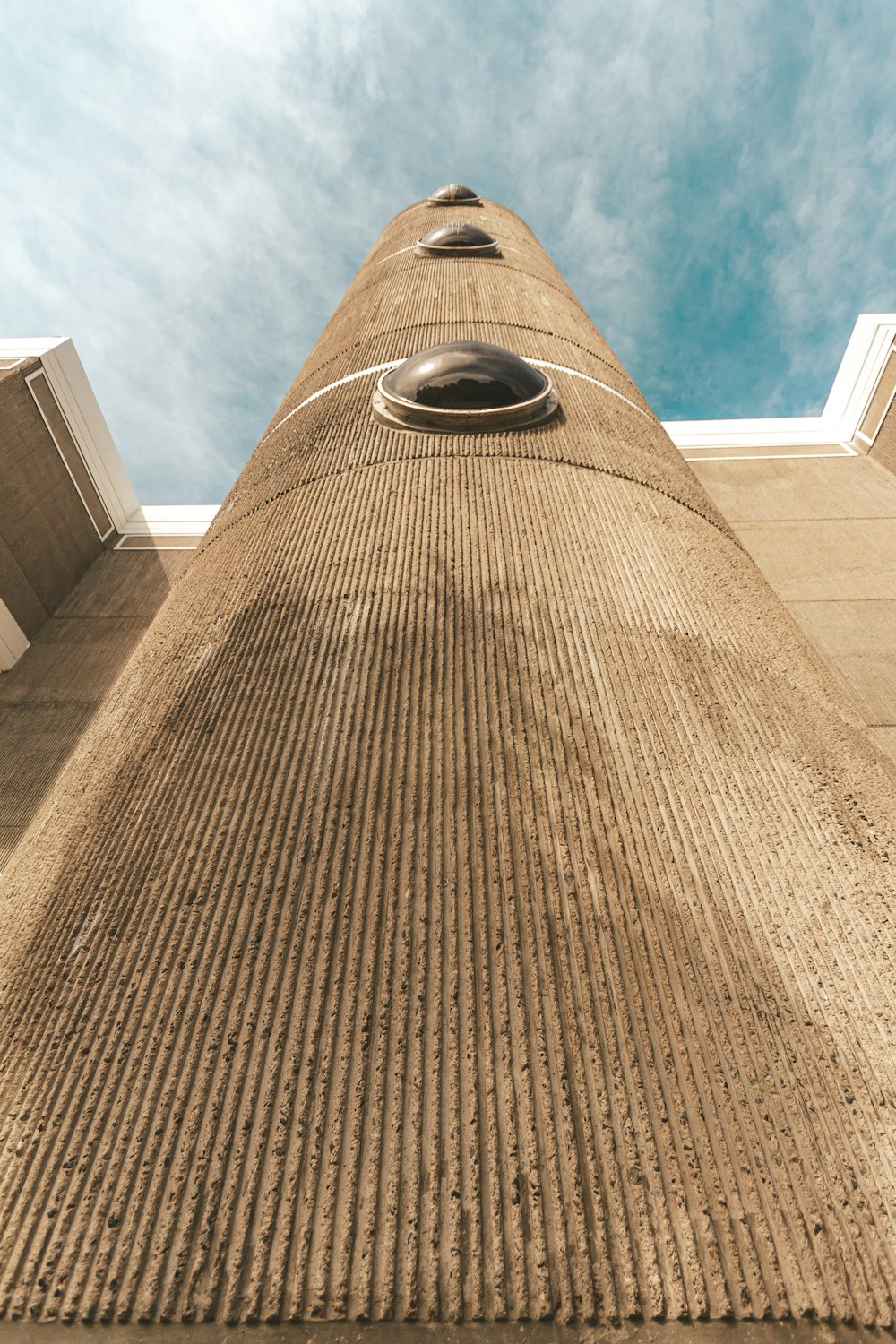 brown brick wall under blue sky during daytime