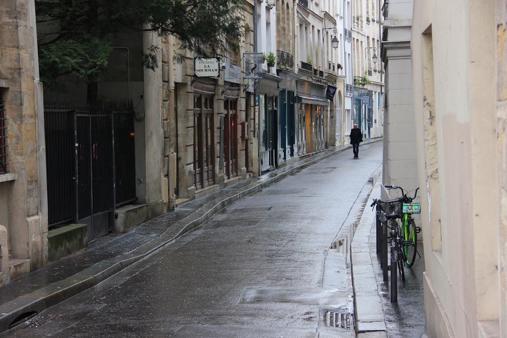 black bicycle parked on sidewalk during daytime