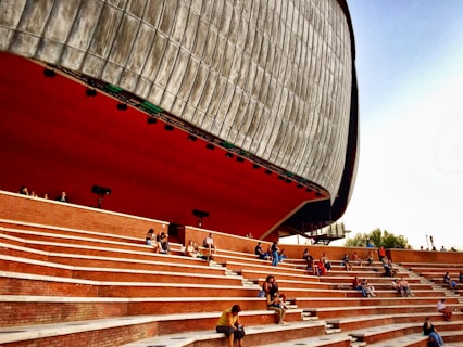 people walking on stairs near building during daytime