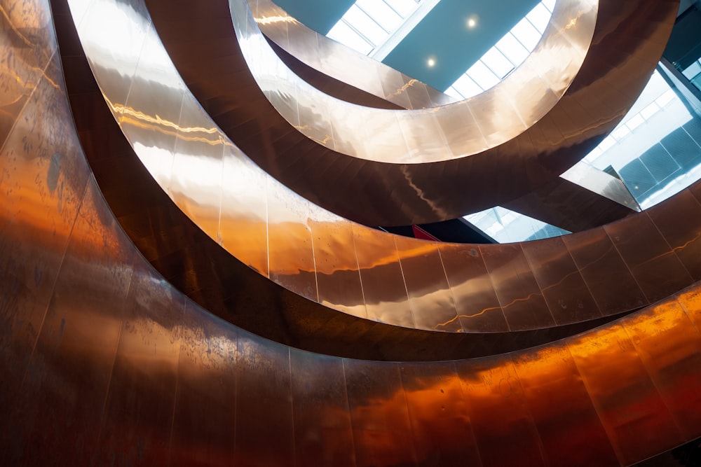 brown spiral staircase with glass windows