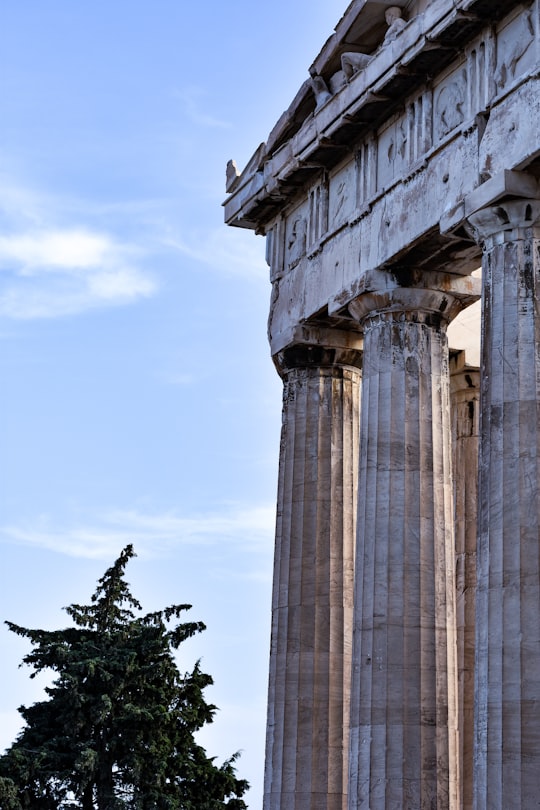 gray concrete pillar under blue sky during daytime in Parthenon Greece
