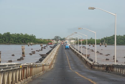 gray concrete bridge over river during daytime guyana zoom background