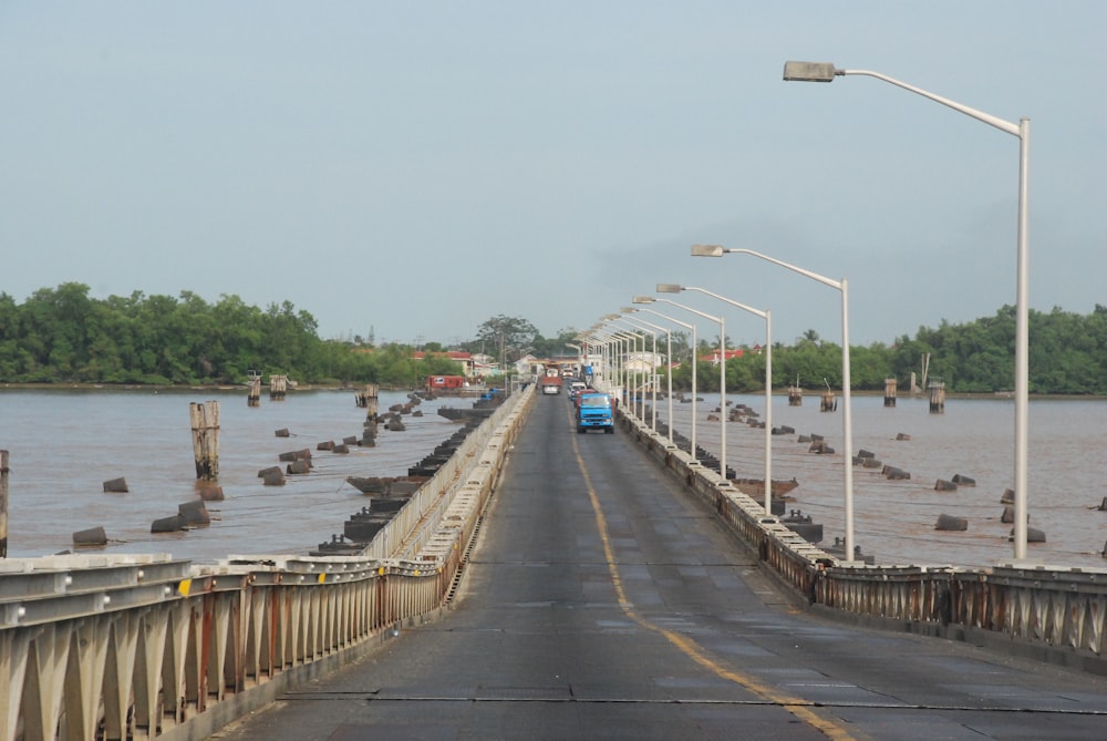 gray concrete bridge over river during daytime