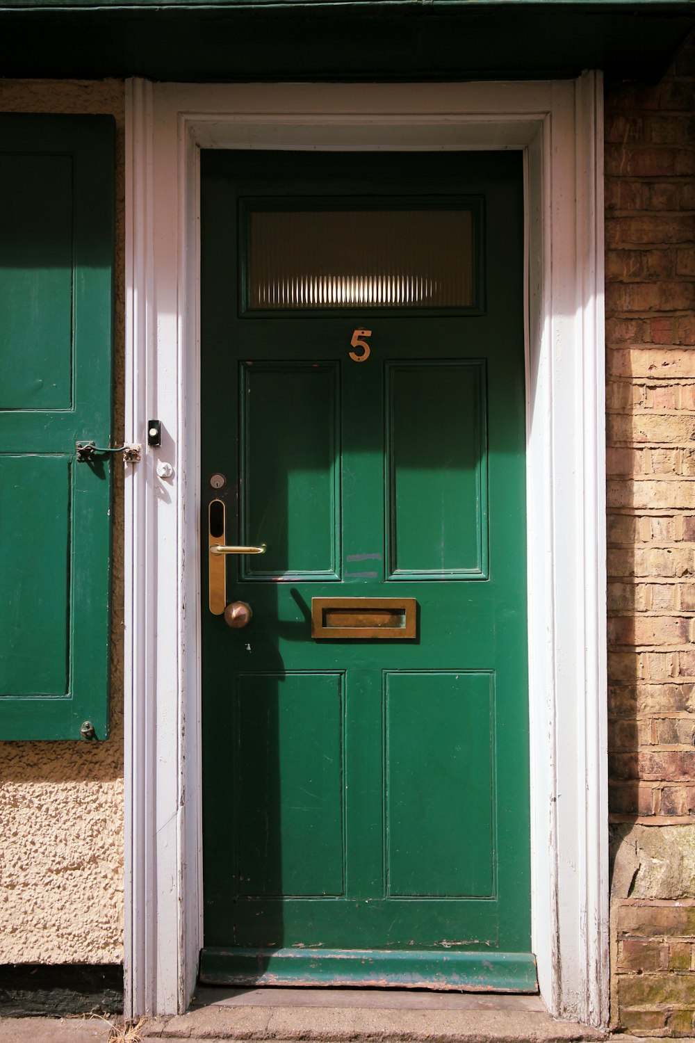 blue wooden door with black steel door knob