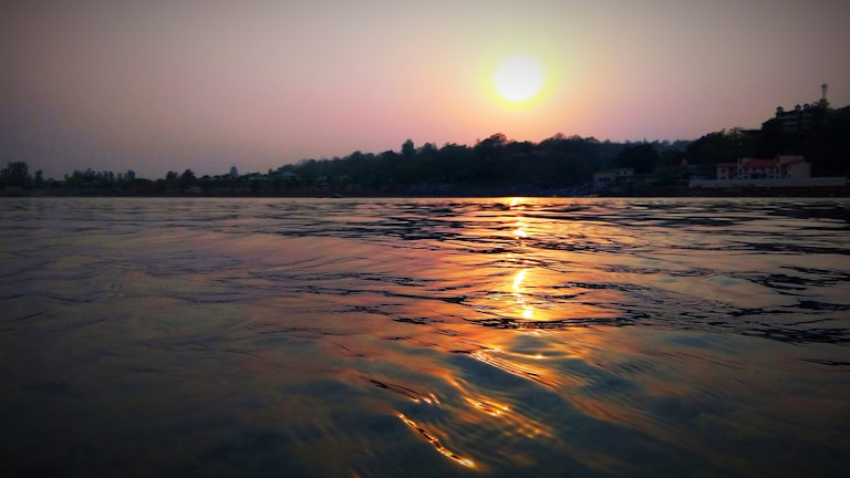 A peaceful meditation scene at sunset.