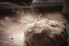 A close-up of flour and dough, highlighting the baking process.
