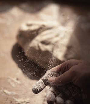 persons hand with white powder