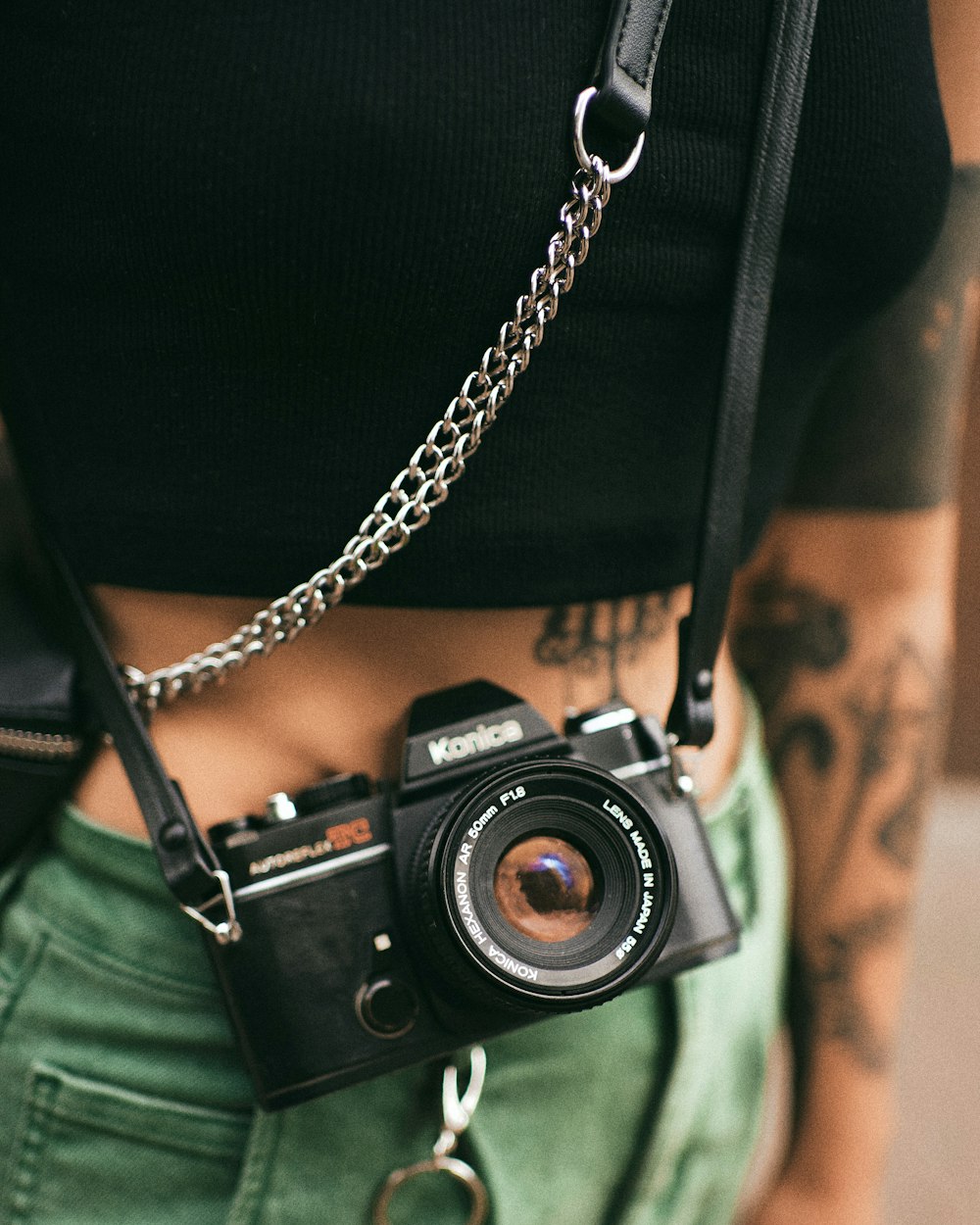 black and silver camera on black textile