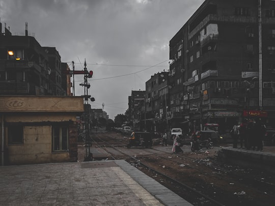 cars on road between buildings during daytime in Cairo Egypt