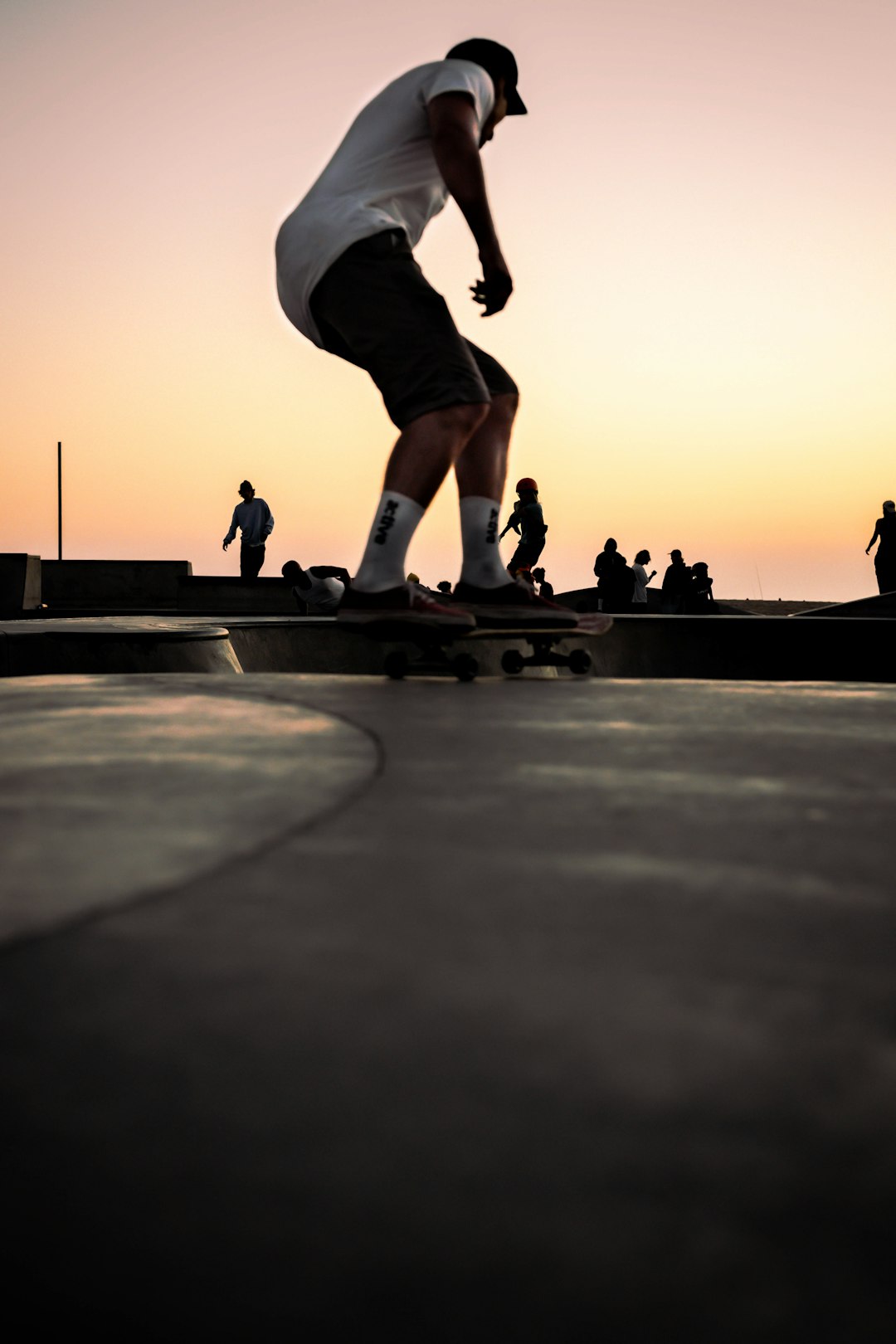 man in black shirt and pants doing skateboard stunts