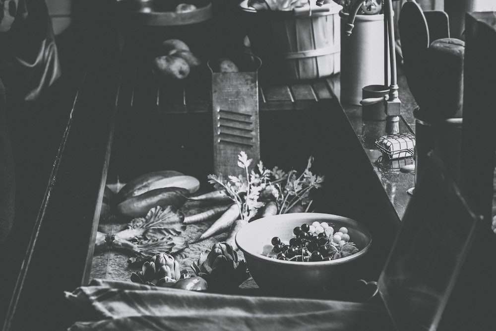 grayscale photo of bowl of food on table