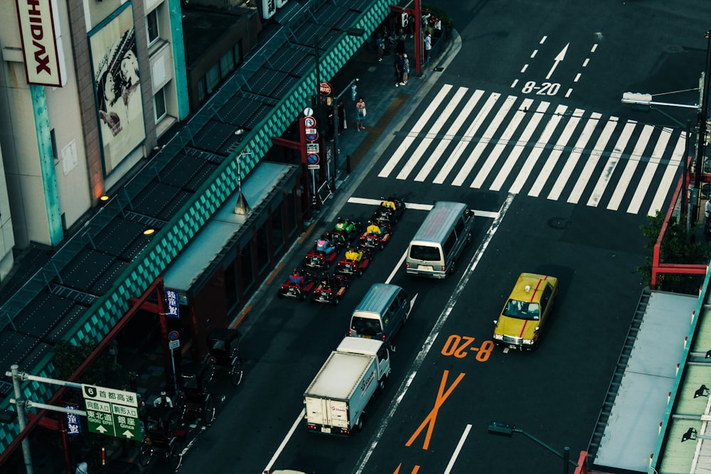 cars on road near buildings during night time