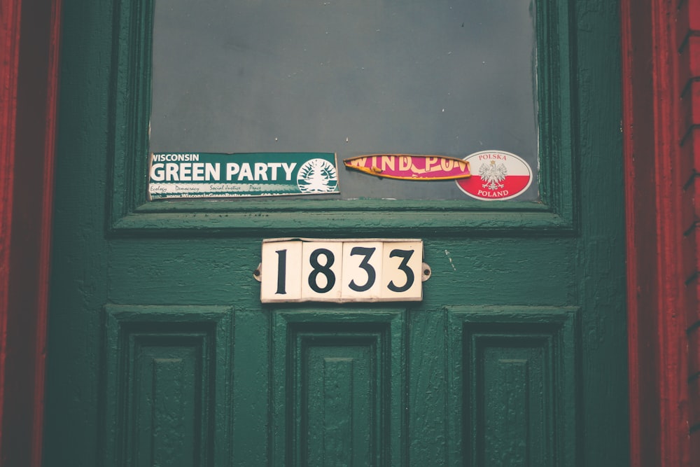 green and white wooden signage