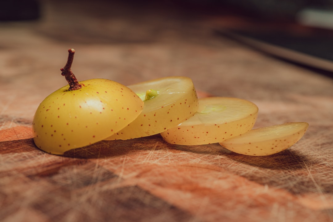 yellow fruit on brown wooden table