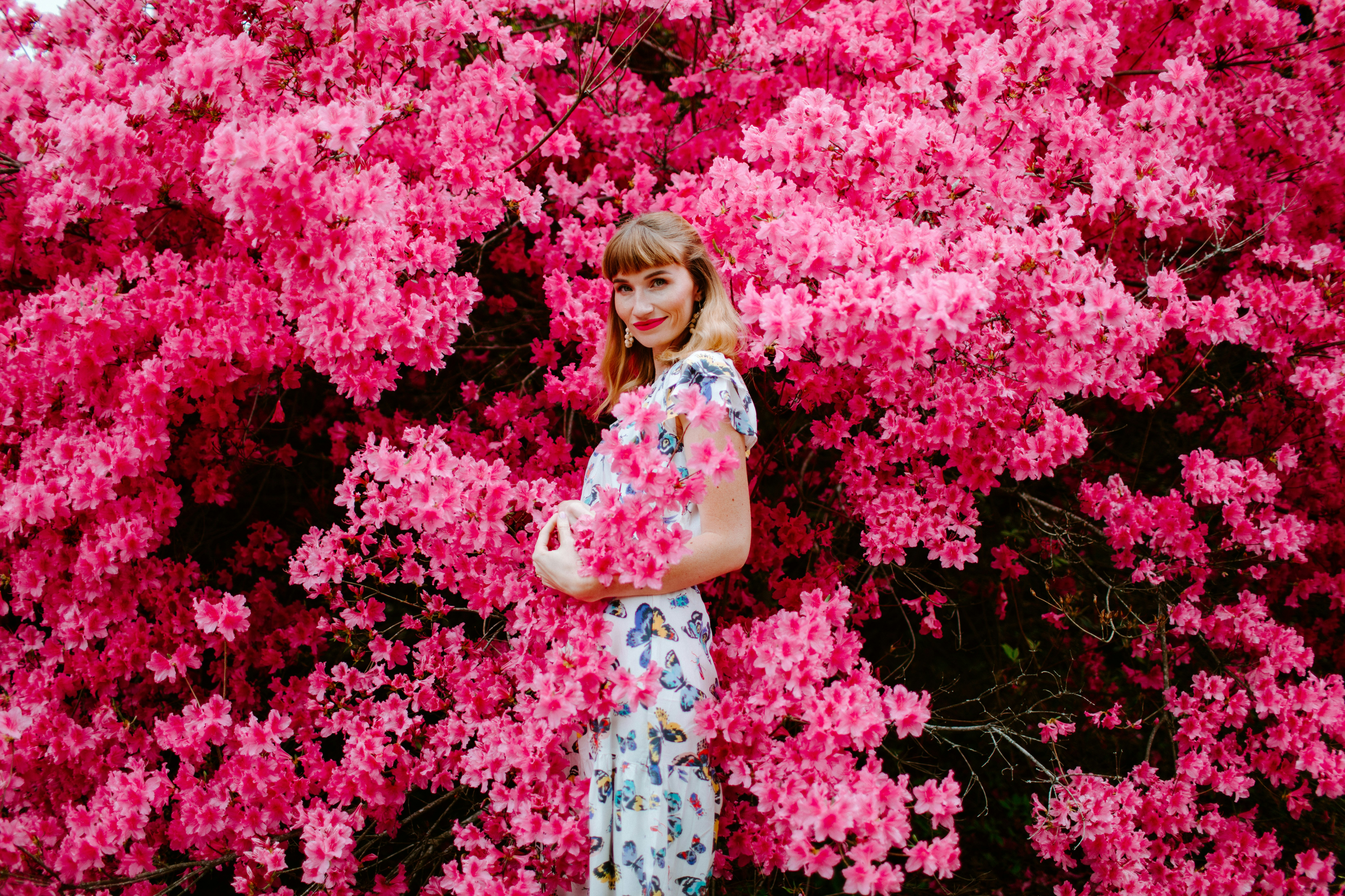 Woman in floral print shift dress, light and airy, spring casual fashion, pastel colors