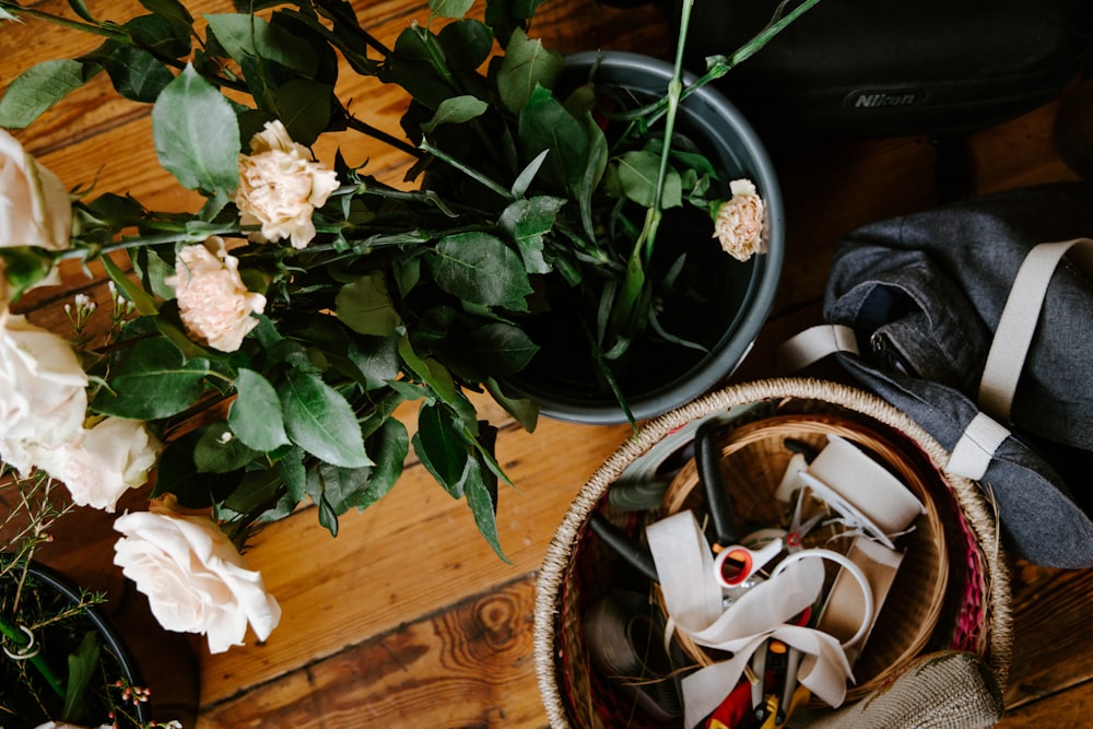 white flowers on brown woven basket