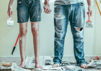 2 person wearing blue denim jeans