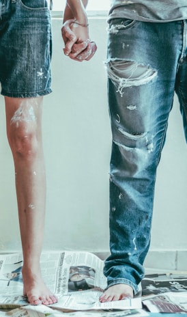 2 person wearing blue denim jeans