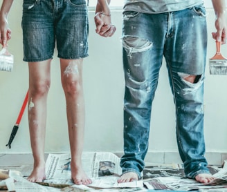 2 person wearing blue denim jeans