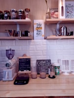 A cozy kitchen counter with various coffee machines lined up for review.