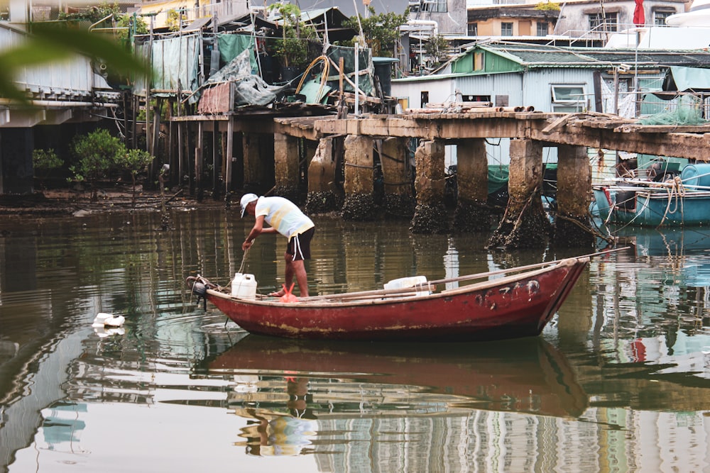 red and white boat on water