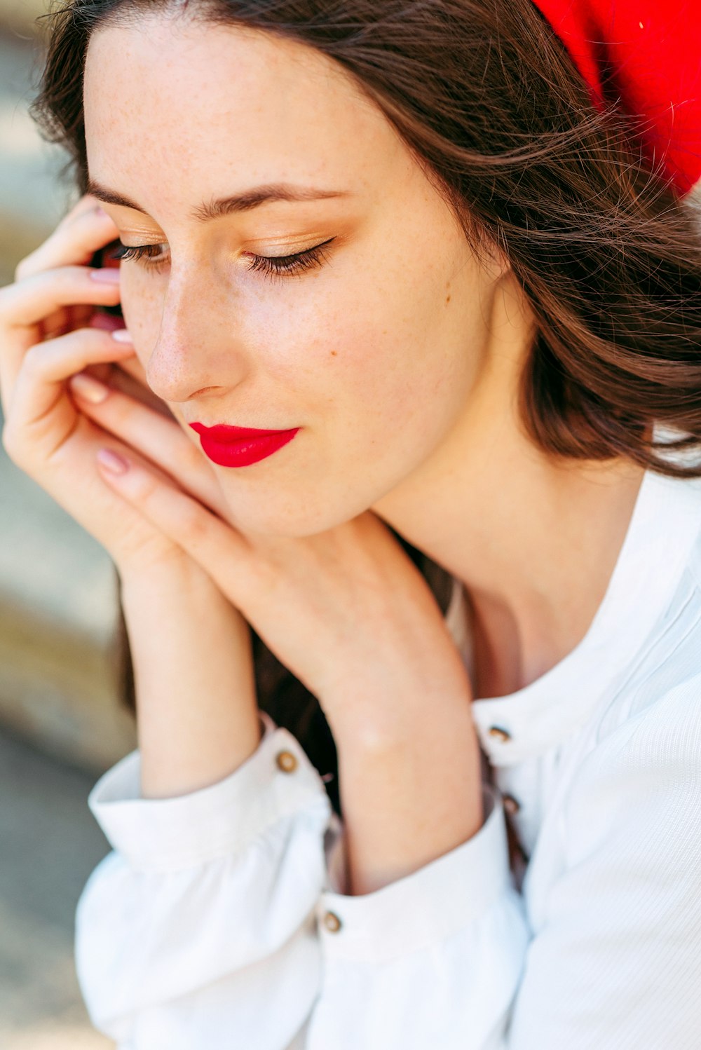 woman in white shirt with red lipstick