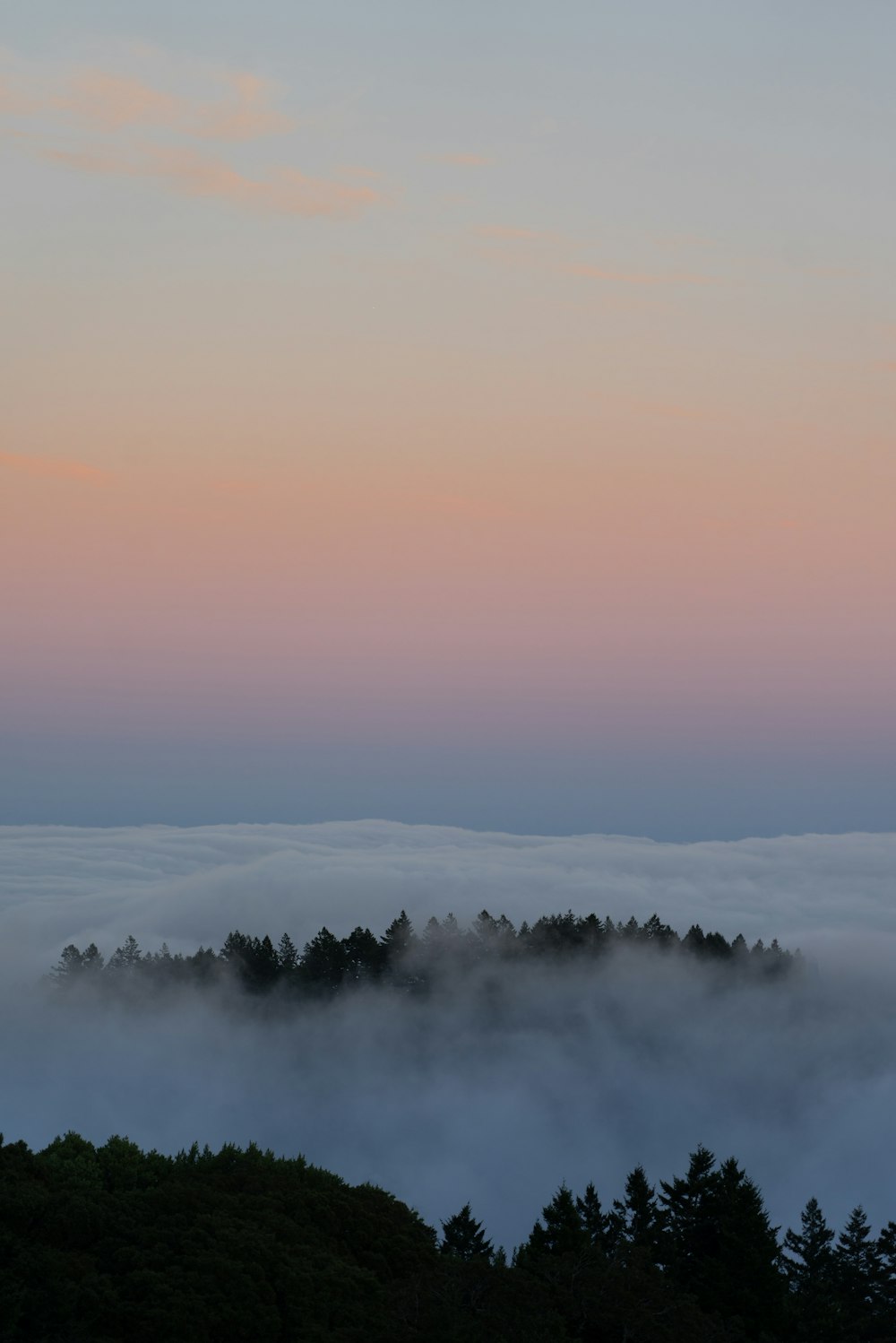 white clouds over the mountains