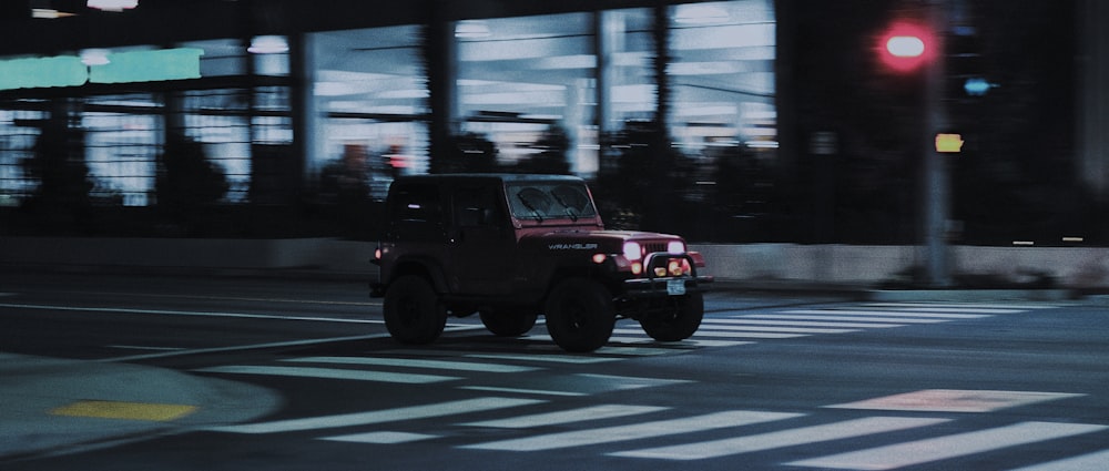 black suv on road during daytime