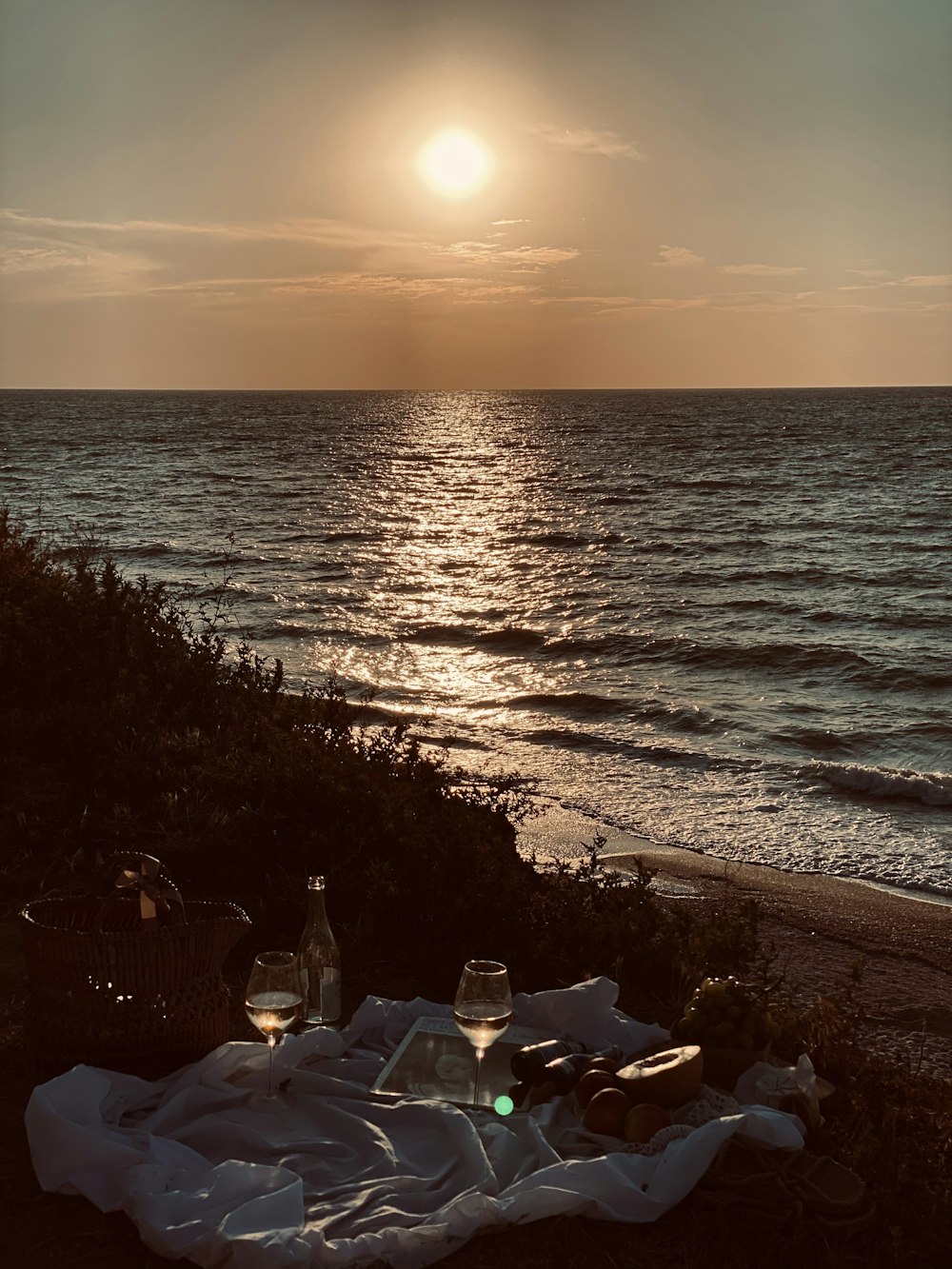 people on beach during sunset