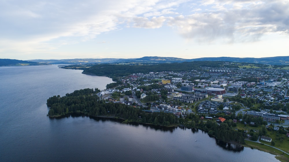 aerial view of city near body of water during daytime