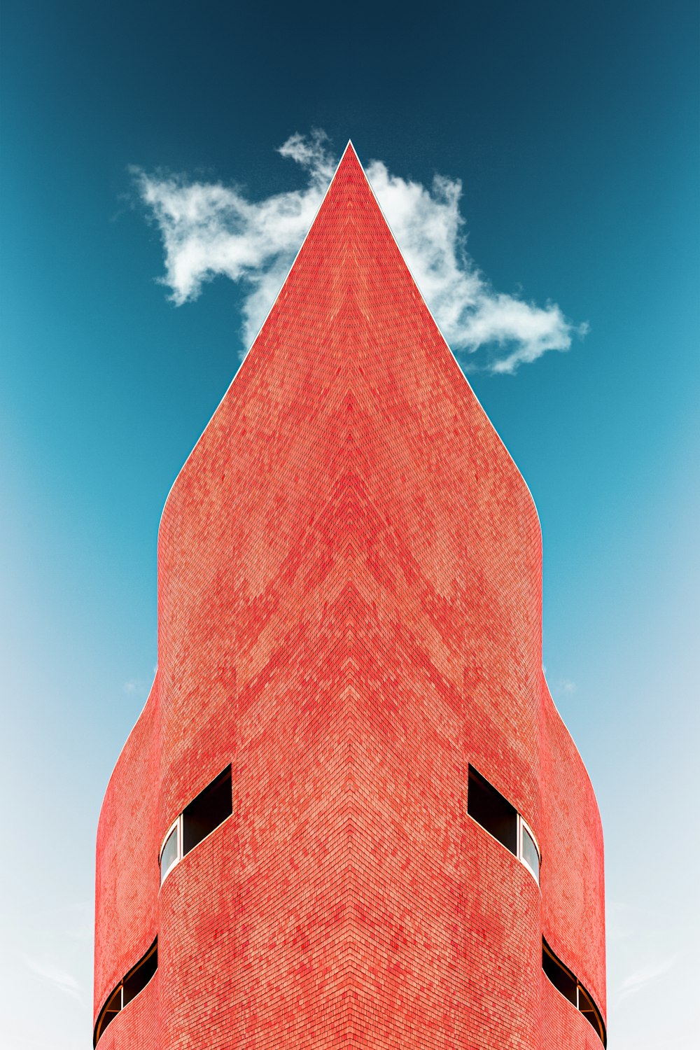 brown brick building under blue sky