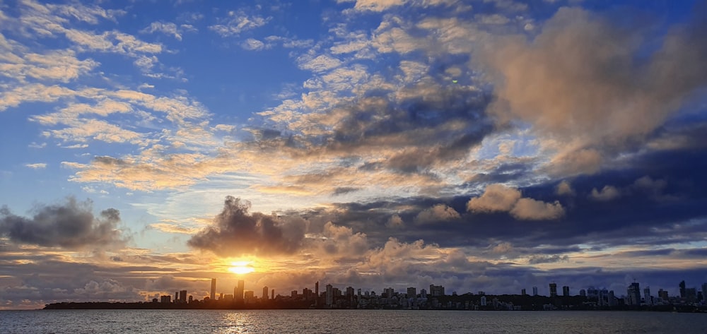 silhouette of city buildings during sunset