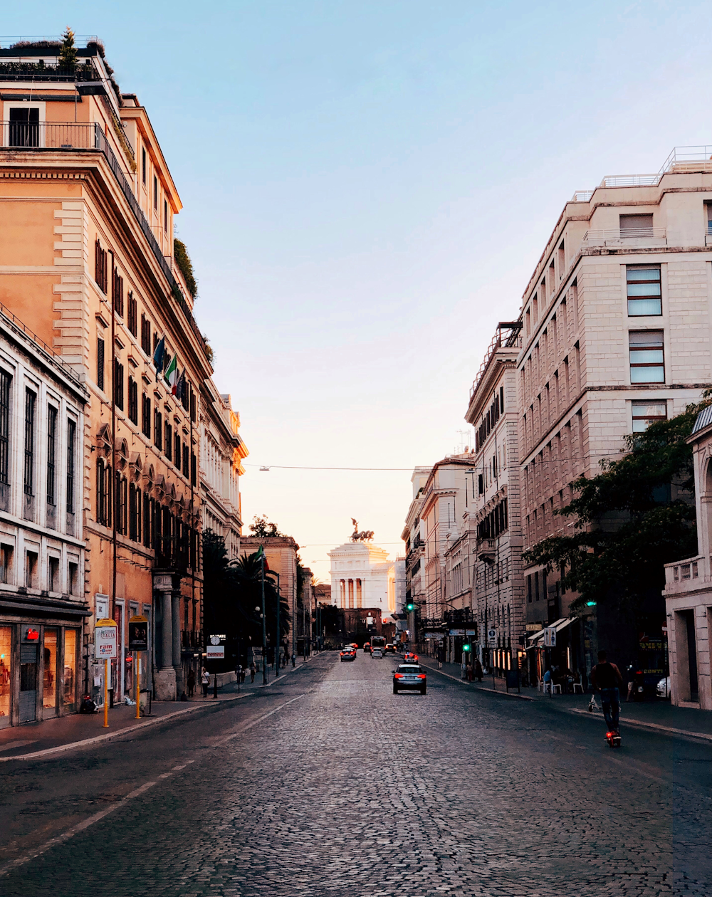 people walking on street between buildings during daytime