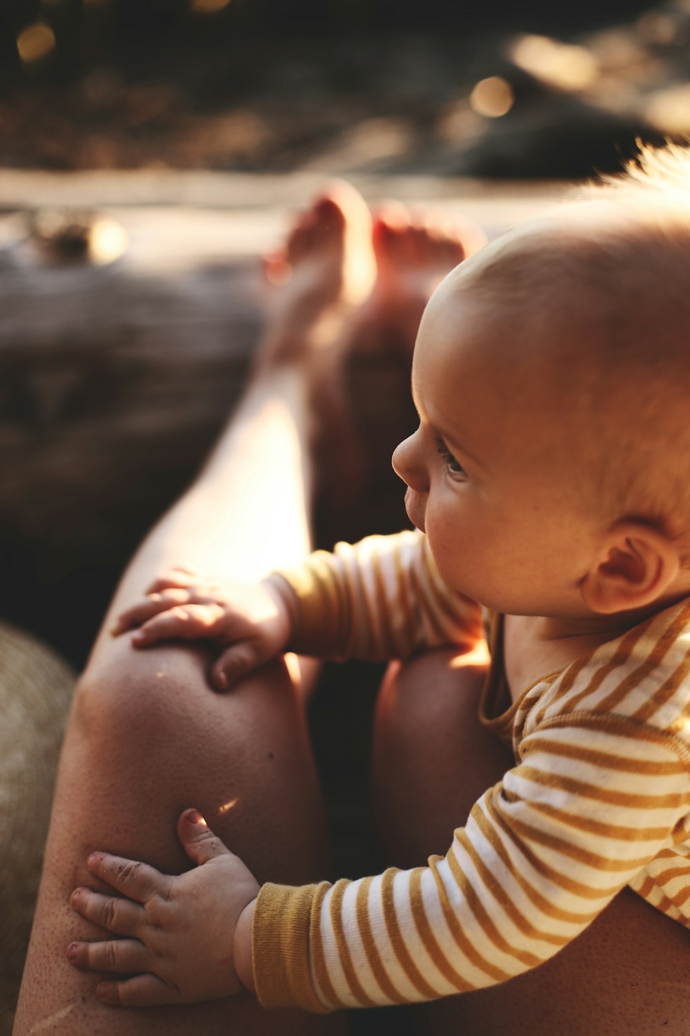 baby in white and red striped shirt