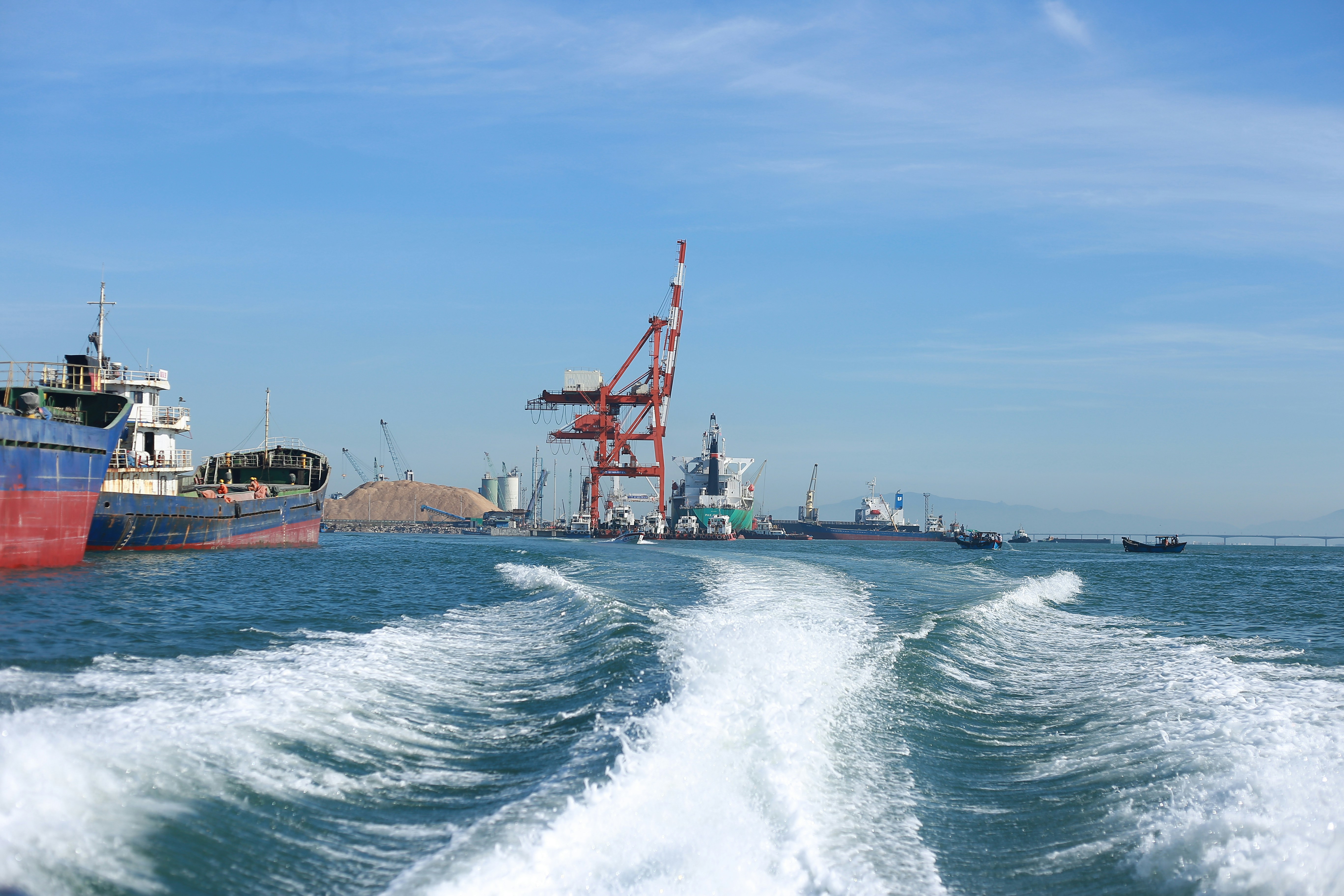red and white ship on sea during daytime