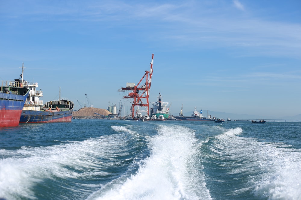 red and white ship on sea during daytime