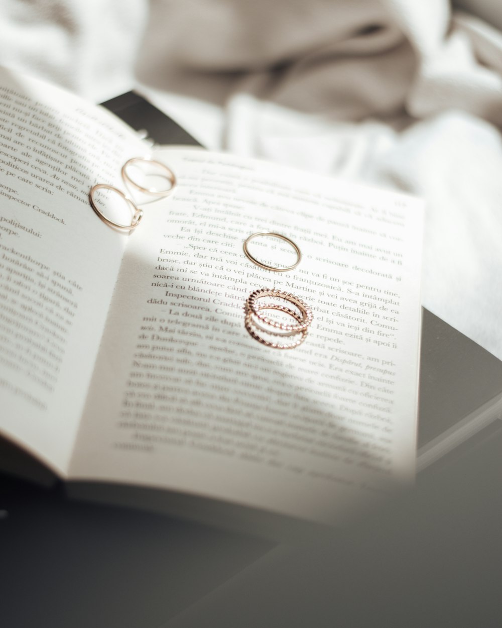 gold ring on white book page