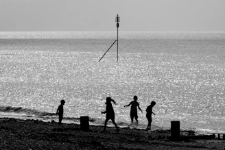 Children playing near the water, highlighting the area's role in family life.