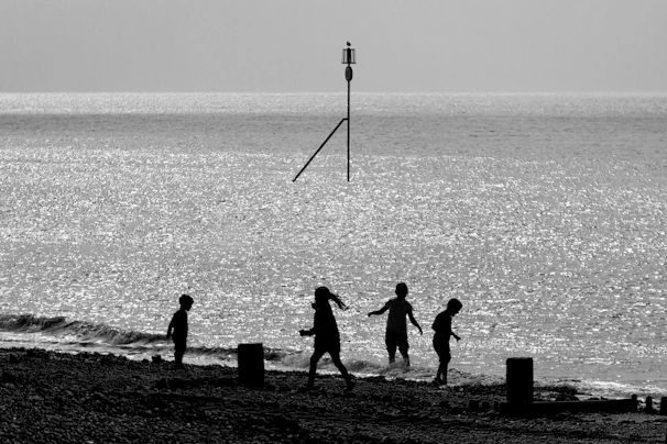 Children playing near the water, highlighting the area's role in family life.