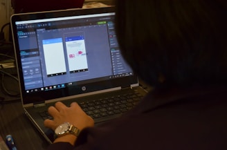woman using black laptop computer