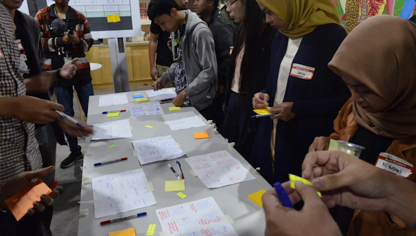 A team collaborating over a bold campaign blueprint.