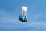 blue and white glass bottle