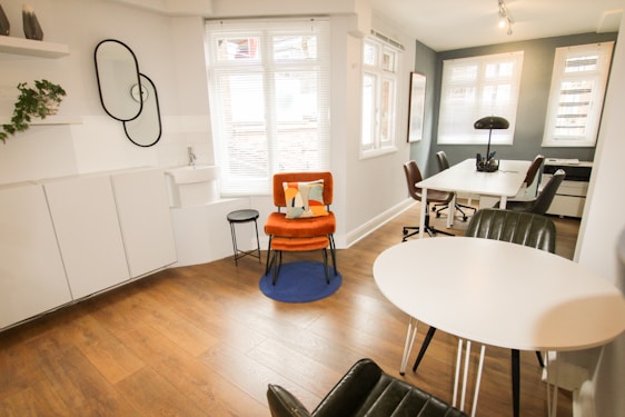 Bright and modern office and home furniture setup with orange and blue accents.